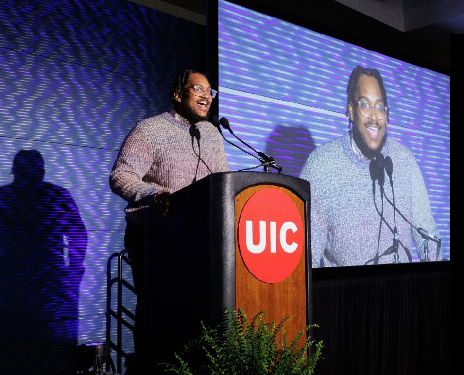 Jacoby Cochran speaking from a podium